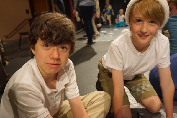 Two boys work on an art project together at Ashbrook Independent School